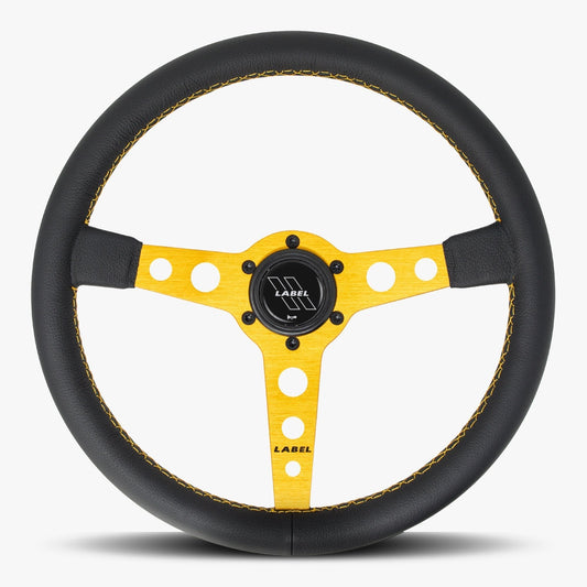 Black leather Daytona steering wheel with gold spoke and gold stitching, designed for high-performance vehicles by Speedzone Performance LLC.