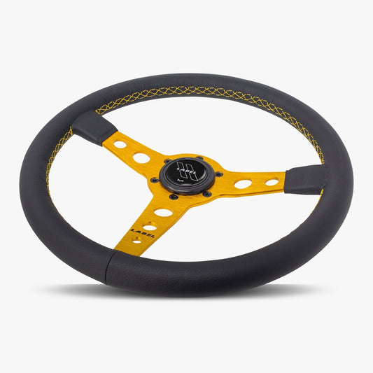 Black leather Daytona steering wheel with gold spoke and gold stitching, designed by Speedzone Performance LLC.