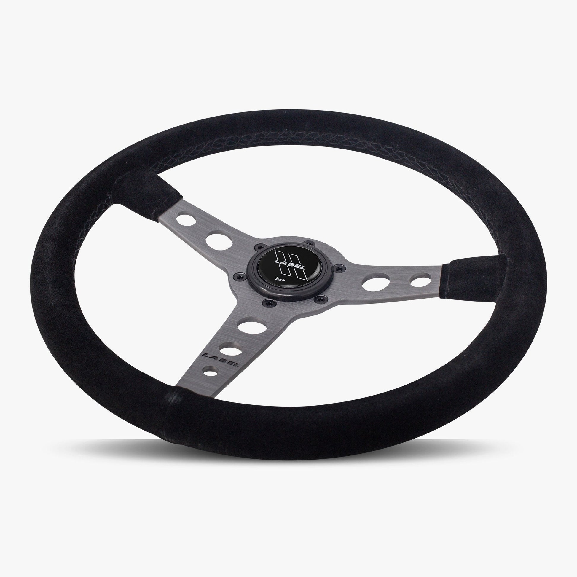 Black Alcantara suede steering wheel with graphite spoke and black stitching, designed for performance vehicles by Speedzone Performance LLC.