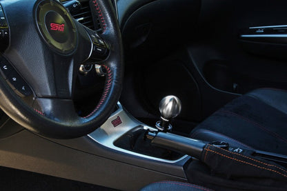 JDMuscle PERRIN 04-21 STI ball shift knob with black finish, ergonomic design, and shift pattern visible in the image.