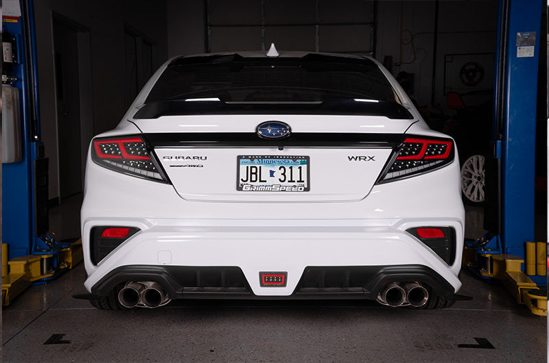 OLM Spec-AR LED taillights for 2022+ Subaru WRX, clear lens with black base and red bar, modern automotive tail lights.