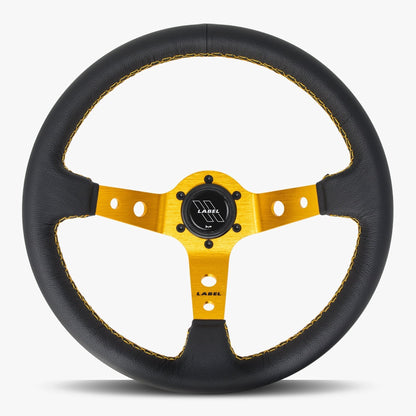 Black leather steering wheel with gold spoke and gold stitching from the Daytona series by Speedzone Performance LLC.