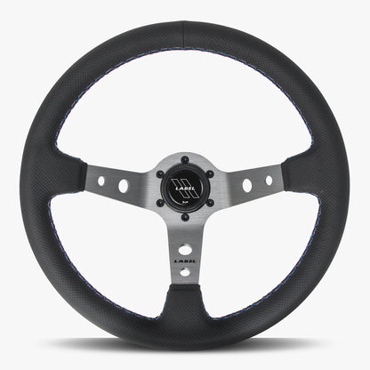 Black perforated leather steering wheel with graphite spoke and Bavarian stitch by Speedzone Performance LLC.