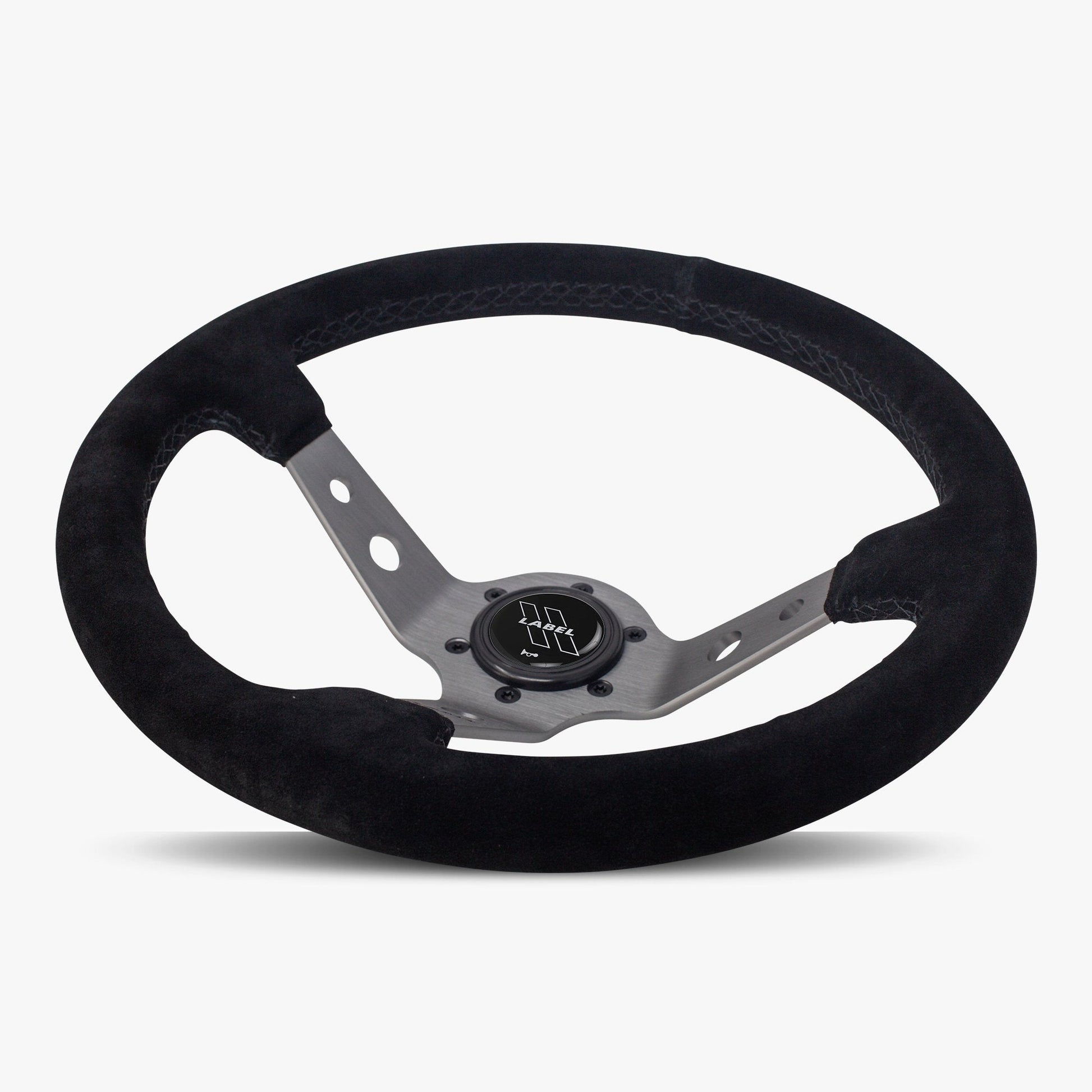 Black Alcantara suede Daytona steering wheel by Speedzone Performance with graphite spoke and black stitching, detailed close-up image.
