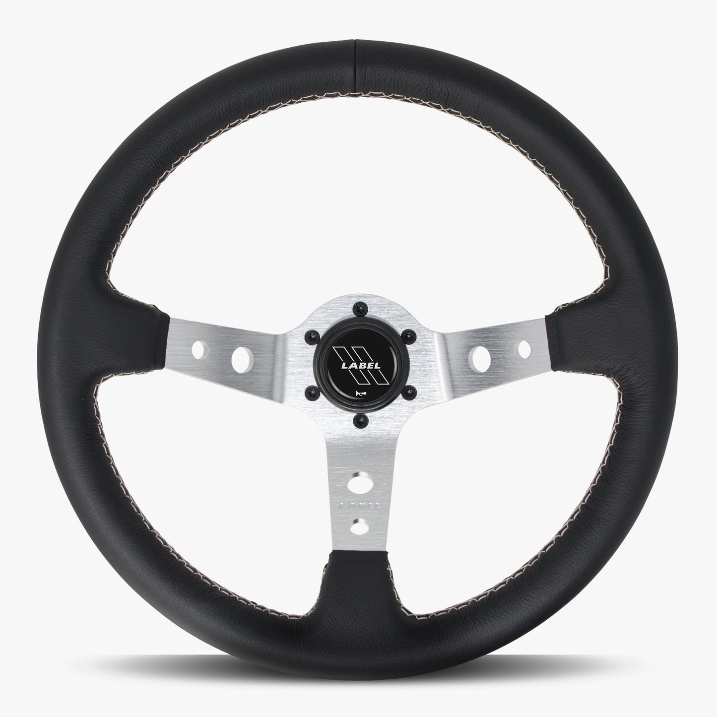 Black leather Daytona steering wheel by Speedzone Performance LLC with silver spokes and black stitching.