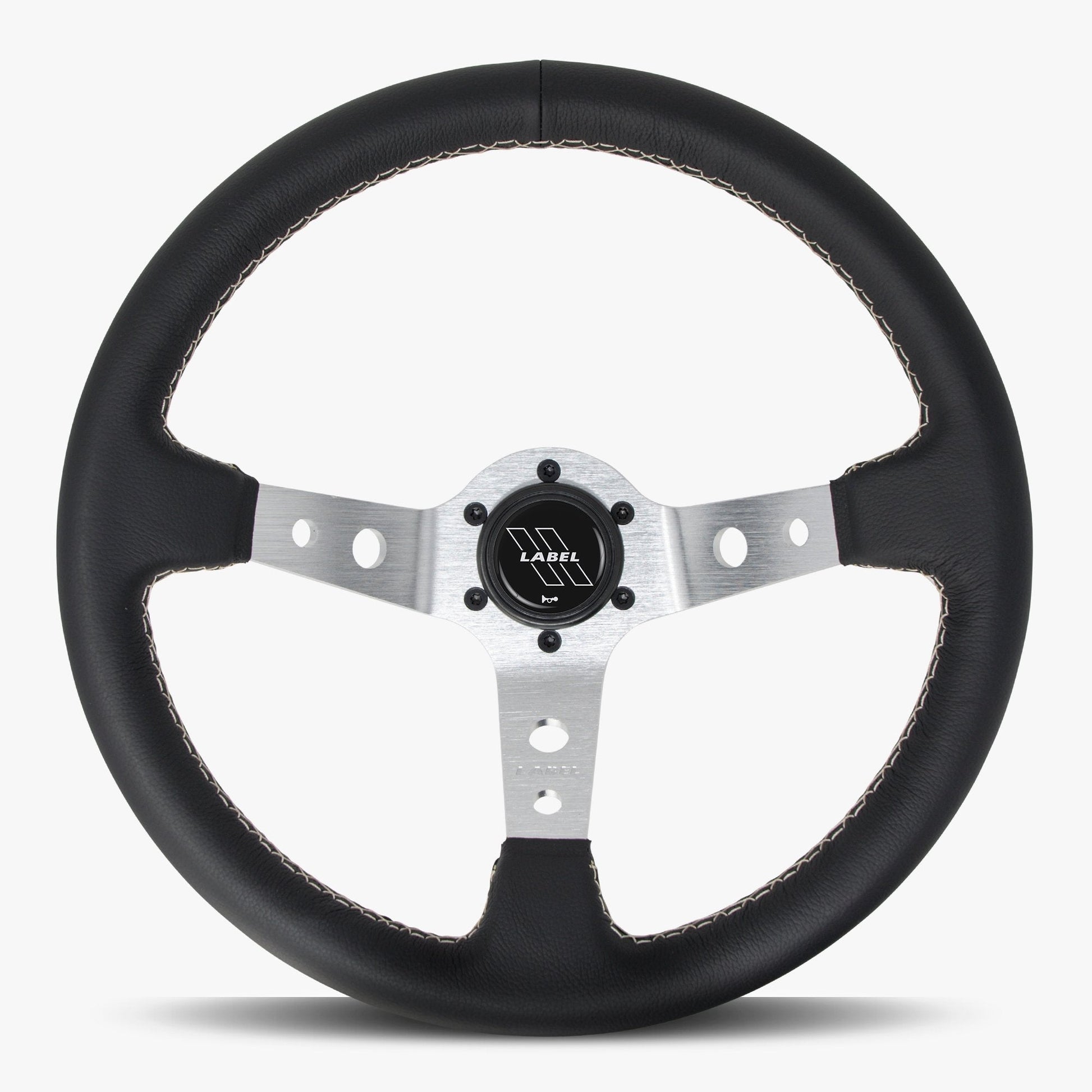 Black leather Daytona steering wheel by Speedzone Performance LLC with silver spokes and black stitching.