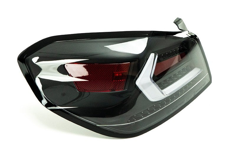 OLM Evolution tail lights with clear lens, black base, and white bar on a 2015-2021 Subaru WRX/STI.