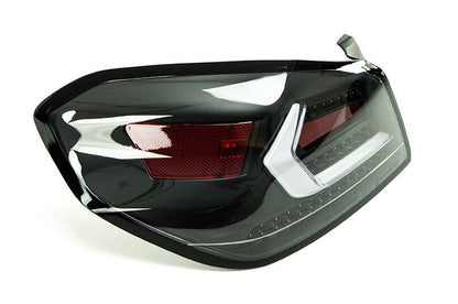 OLM Evolution tail lights with clear lens, black base, and white bar on a 2015-2021 Subaru WRX/STI.