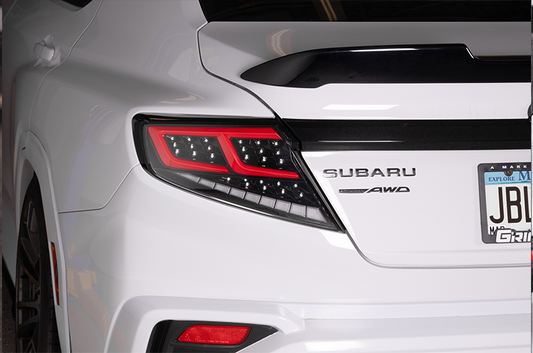 OLM Spec-AR LED taillights for 2022+ Subaru WRX, clear lens with black base and red bar, showcasing modern vehicle lighting.