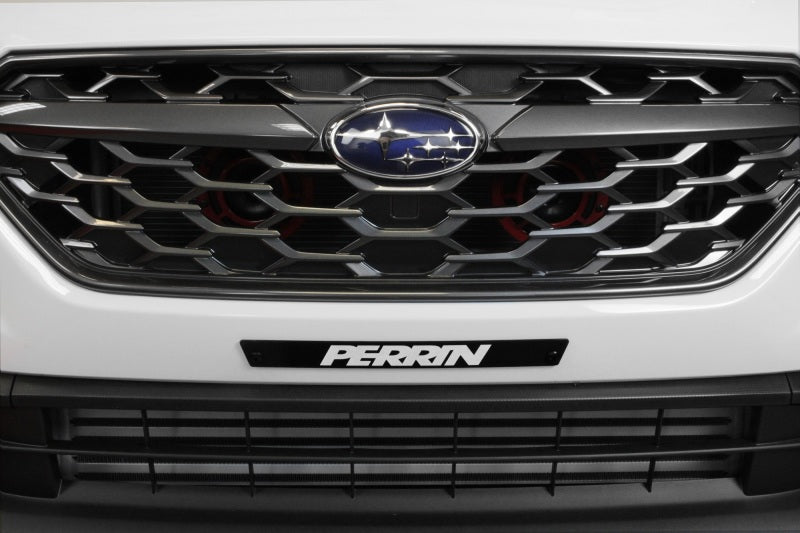 Black license plate delete for 2022-2025 Subaru WRX by Perrin, mounted on front bumper, sleek and minimalist design.