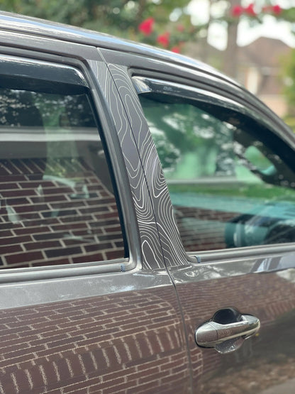 Vinyl Topo B Pillar overlays for 2016-2023 Tacoma Double Cab, exterior decals by StickerFab on vehicle window pillars.