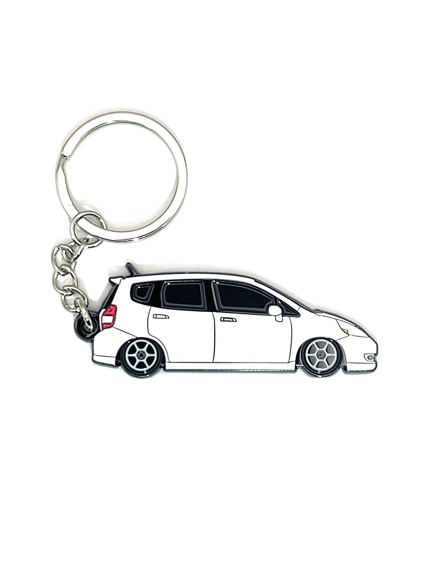 Drift Pins GD Fit keychains with branded metal tags and colorful rubber keyring, attached to a set of keys on a wooden surface.