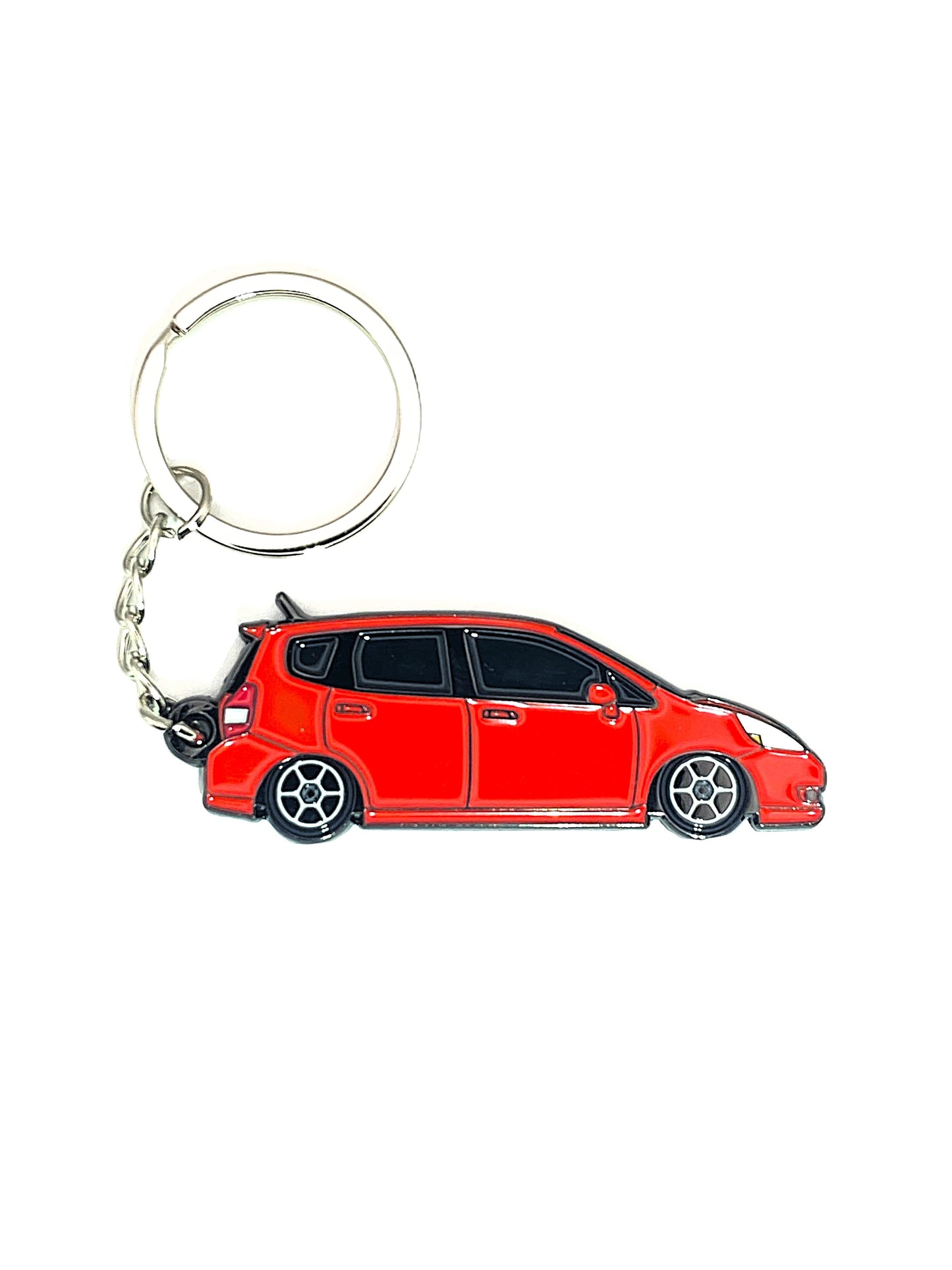 Drift Pins GD Fit keychains featuring colorful metal designs on a simple background, showcasing their compact size.