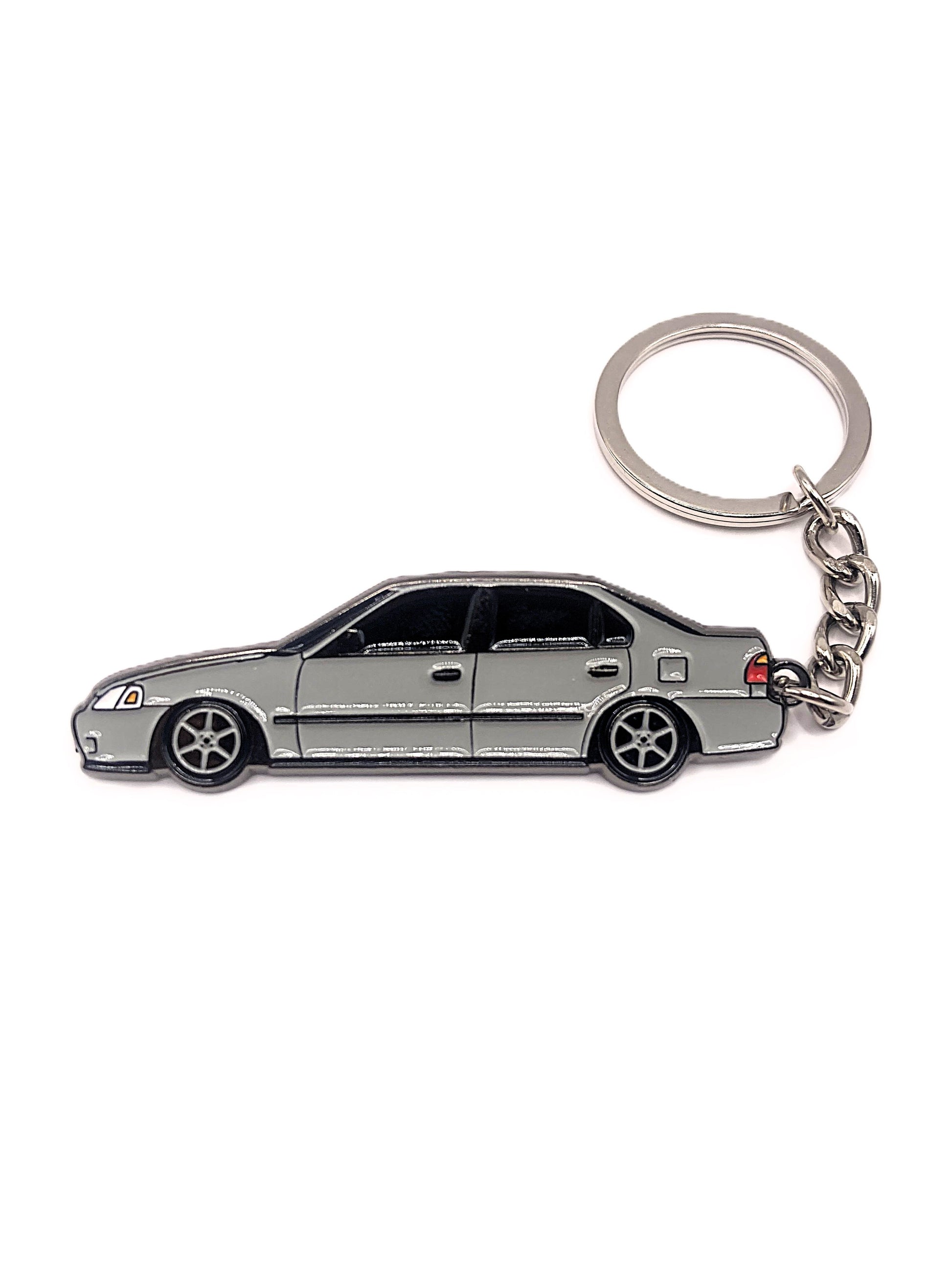 Drift Pins EK Sedan keychain featuring a detailed miniature car model attached to a metal keyring.