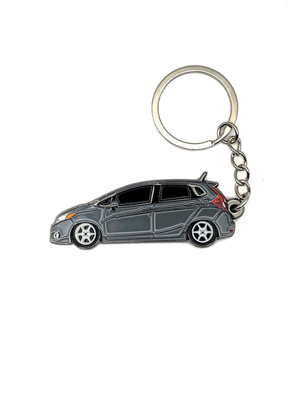 Drift Pins GK Fit keychains featuring durable metal design with branded logo and sleek finish.