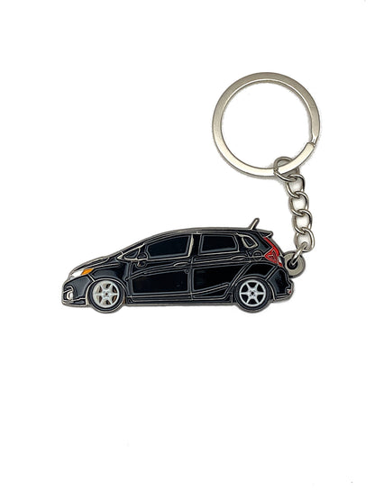Drift Pins GK Fit keychains featuring metal design with engraved logo, perfect for attaching to keys or bags.