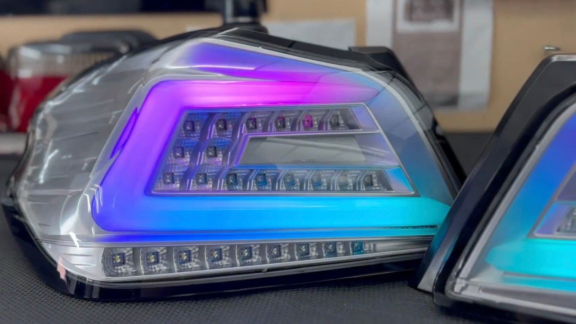 NTXGlow clear RGB color-shifting tail lights for 2015-2021 Subaru WRX and STI, with sleek design and vibrant lighting.