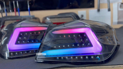NTXGlow black RGB color-shifting tail lights for 2015-2021 Subaru WRX and STI, featuring sleek design and vibrant lighting effects.