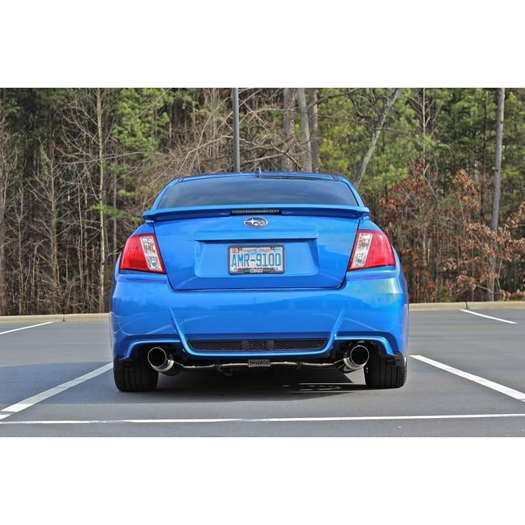 Invidia Dual N1 Burnt Titanium Tips cat back exhaust system on a 2008-2014 Subaru WRX/STI sedan, showcasing polished titanium tips.