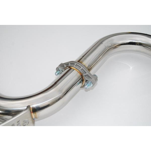 Invidia N1 dual cat back exhaust system with burnt titanium tips on a Subaru WRX STI sedan, showcasing the sleek exhaust design.