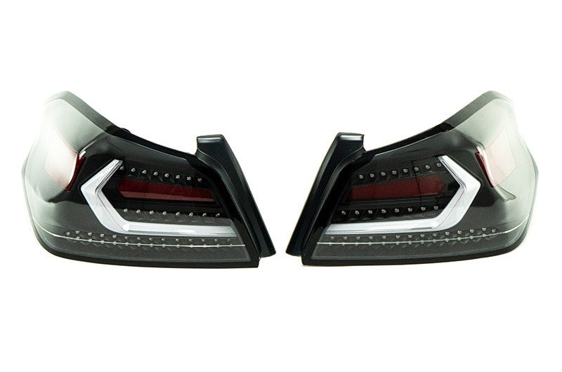 OLM Evolution tail lights for 2015-2021 Subaru WRX STI, clear lens with black base and white bar, mounted on vehicle.