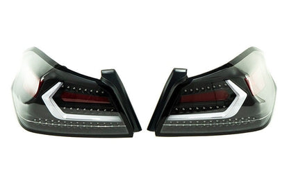 OLM Evolution tail lights for 2015-2021 Subaru WRX STI, clear lens with black base and white bar, mounted on vehicle.