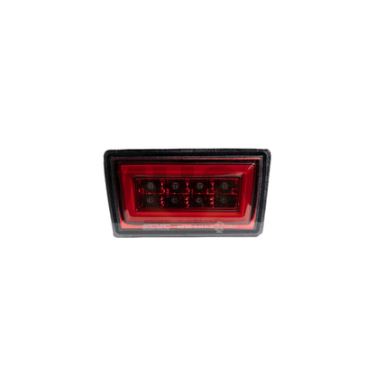 JDMuscle F1 style rear fog and brake light for 2015-2021 Subaru WRX and STI, featuring a clear lens and red bar design.