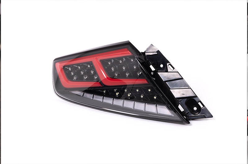 OLM Spec-AR LED taillights for 2022+ Subaru WRX, clear lens with black base and red bar, showcasing modern tail light design.