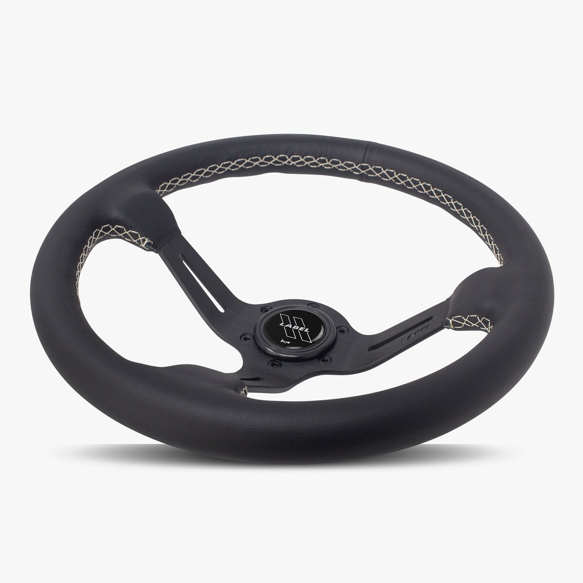 Black leather steering wheel with black spoke and white stitching from Speedzone Performance LLC, The Le Mans model.