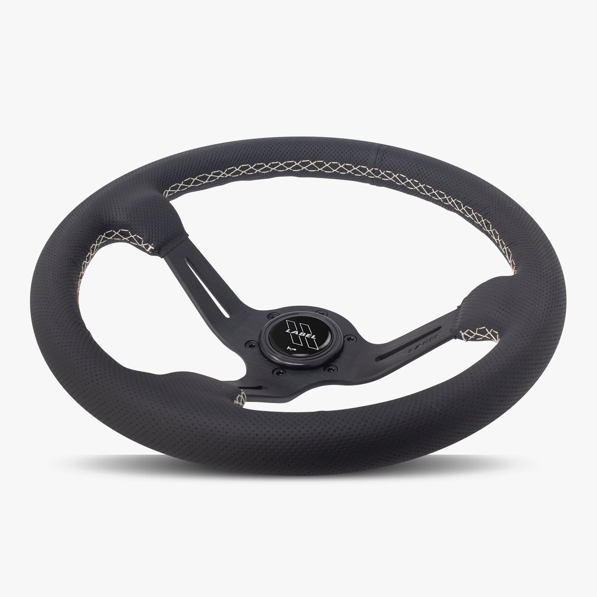 Black perforated leather steering wheel with white stitching and black spoke, designed for performance vehicles.