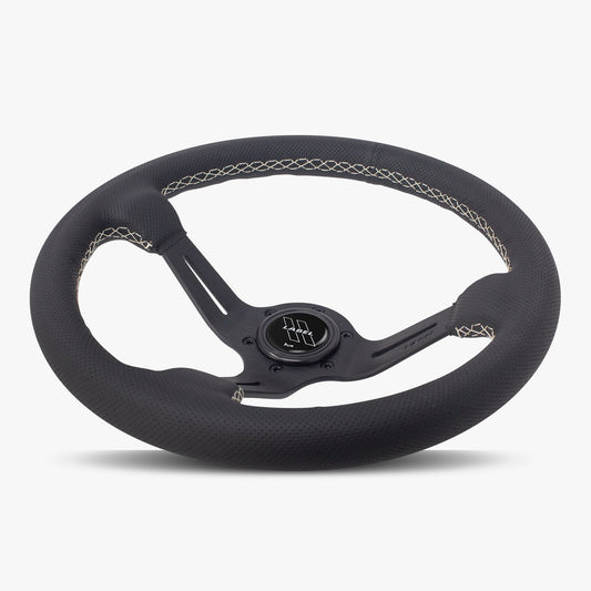 Black perforated leather steering wheel with white stitching and black spoke, designed for performance vehicles.