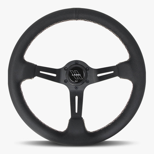 Black perforated leather steering wheel with white stitching and black spoke, designed for performance cars by Speedzone Performance LLC.