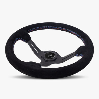Black Alcantara suede steering wheel with black spoke and Bavarian stitch by Speedzone Performance LLC, featuring a sleek design.