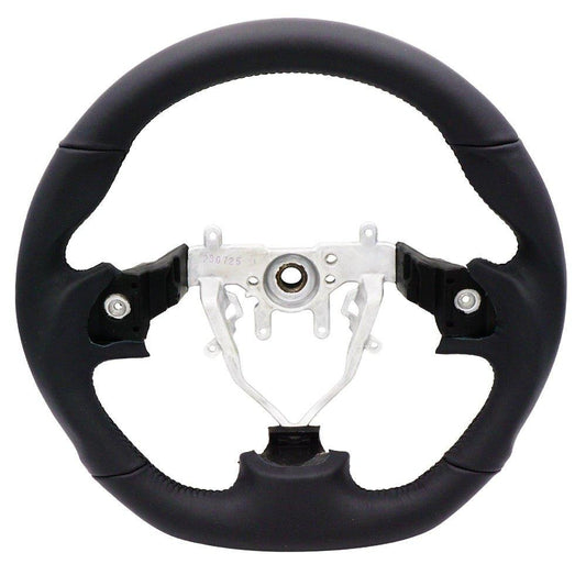BLOX Racing leather steering wheel for 2008-2014 Subaru WRX and STI interior, showing textured black leather and sporty design.