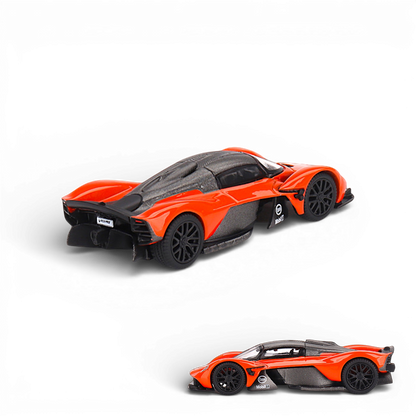 Mini GT Aston Martin Valkyrie diecast model in maximum orange, 1:64 scale, showcasing detailed design and sleek sports car features.