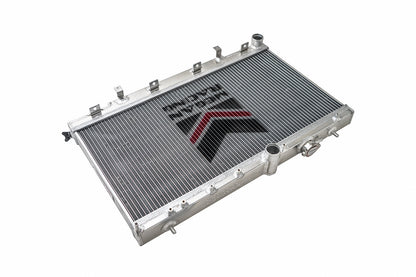 FR SPORT Megan Racing 2-Row Aluminum Radiator for 2002-2007 Subaru WRX/STI, showing the sleek aluminum core and fittings.