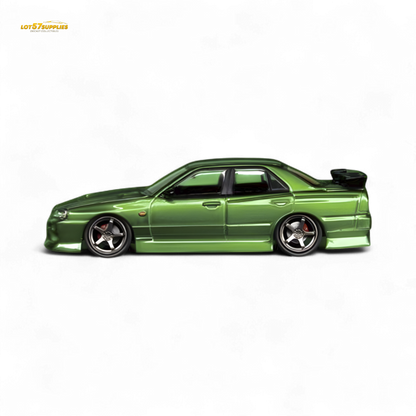 Metallic green Nissan Skyline ER34 Uras diecast model in 1:64 scale, featuring transparent details and intricate design.