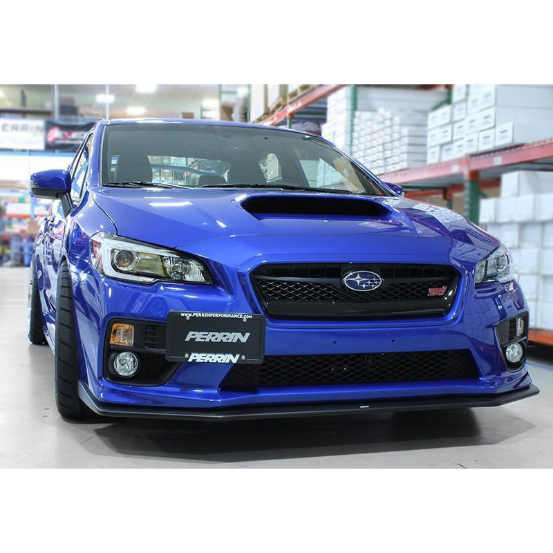 JDMuscle Perrin 15-17 WRX/STI license plate relocation kit on a Subaru with the license plate attached to the kit.