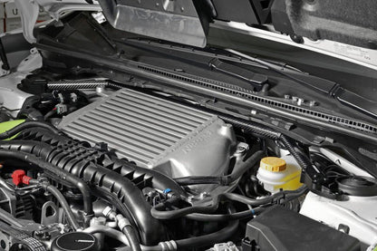 Perrin universal carbon fiber strut brace with billet feet, designed for improved chassis stability in performance vehicles.