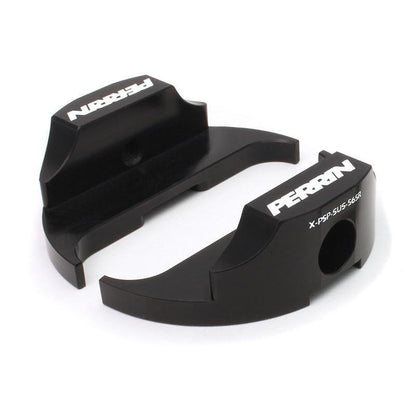 PERRIN Steering Dampener Lockdown Kit with Subaru WRX and Legacy GT steering rack bushings, black metal components, and mounting hardware.