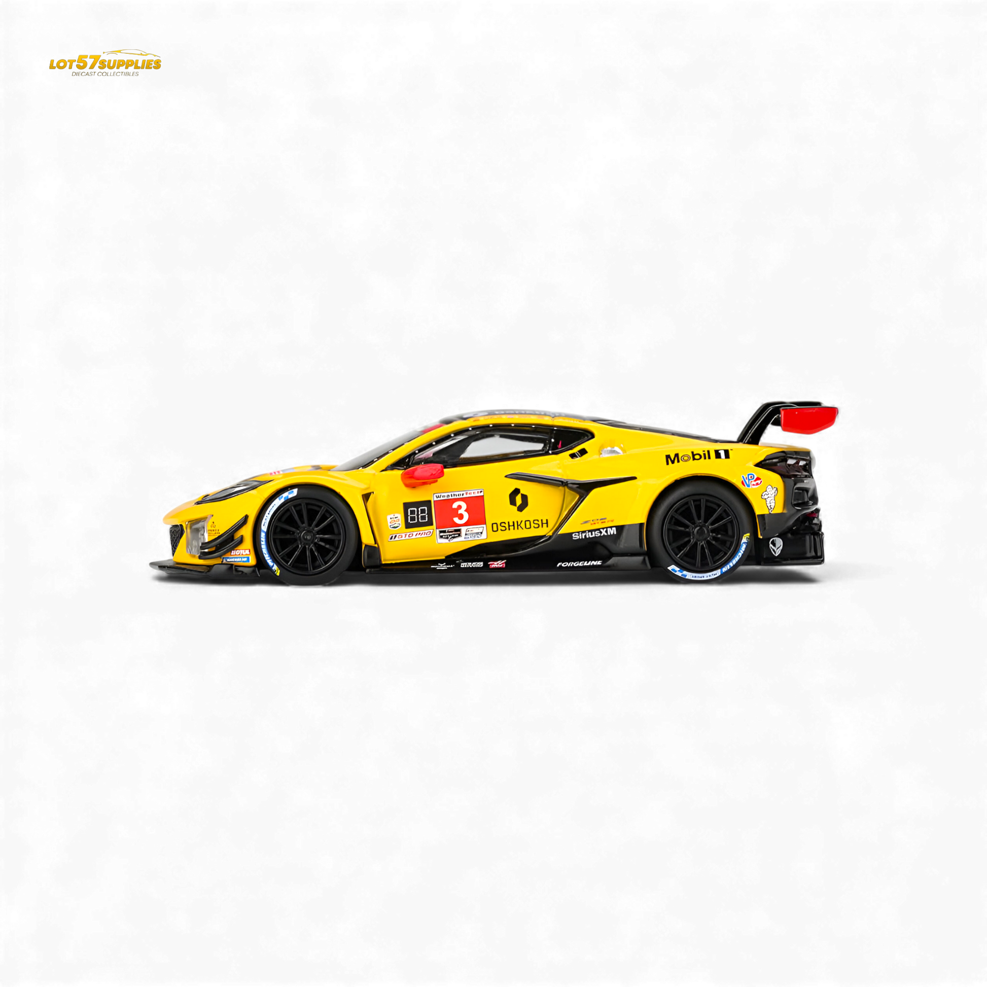 Mini-GT Chevrolet Corvette Z06 GT3.R diecast model in 1:64 scale, detailed black and yellow racing car, front view.