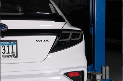 OLM Spec-AR LED taillights with smoke lens, black base, and white bar for 2022+ Subaru WRX, showcasing sleek tail light design.