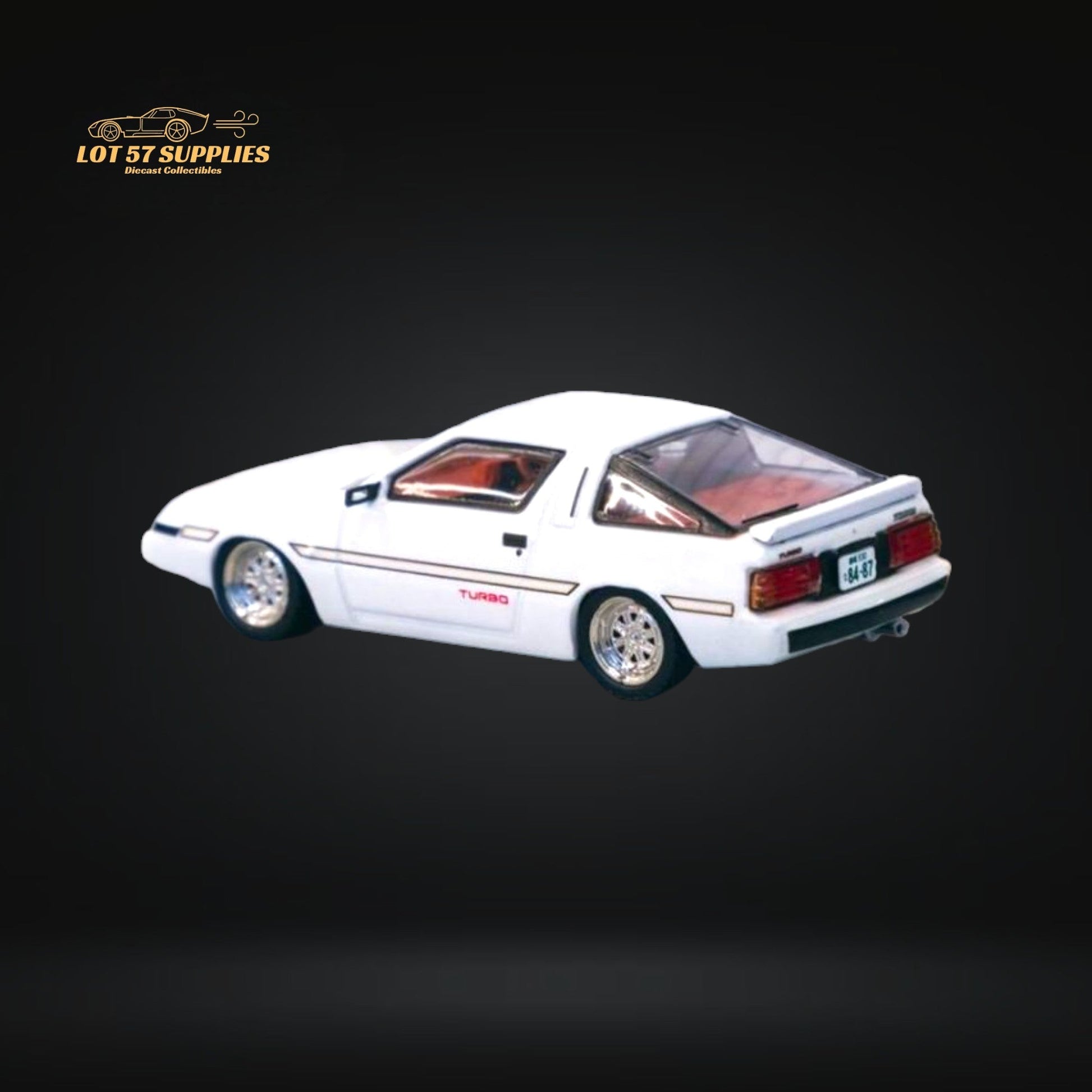 White Tarmac Works Mitsubishi Starion diecast model in 1:64 scale, showcasing detailed exterior features and compact size.