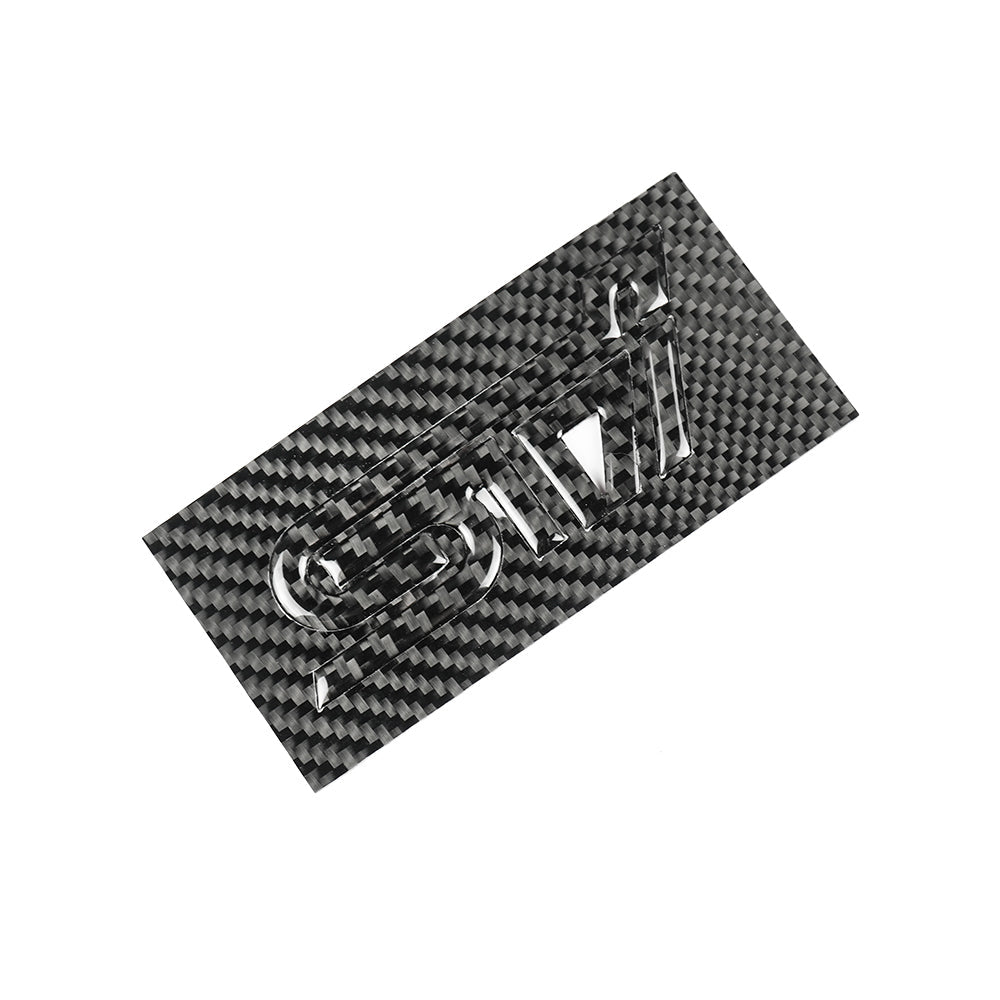 JDMuscle Racing Art Carbon Fiber STI trunk emblem, a sleek automotive ornament with a black carbon fiber finish.