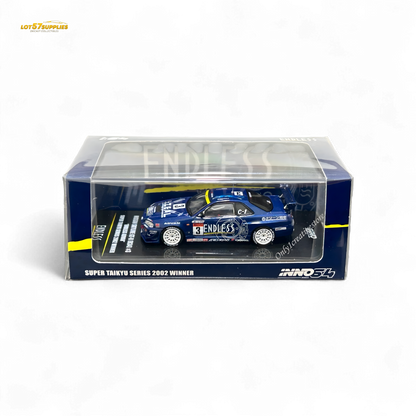 Detail of Inno64 Nissan Skyline GT-R R34 diecast model in #3 Endless Advan livery, showcasing the blue and white Nissan sports car.