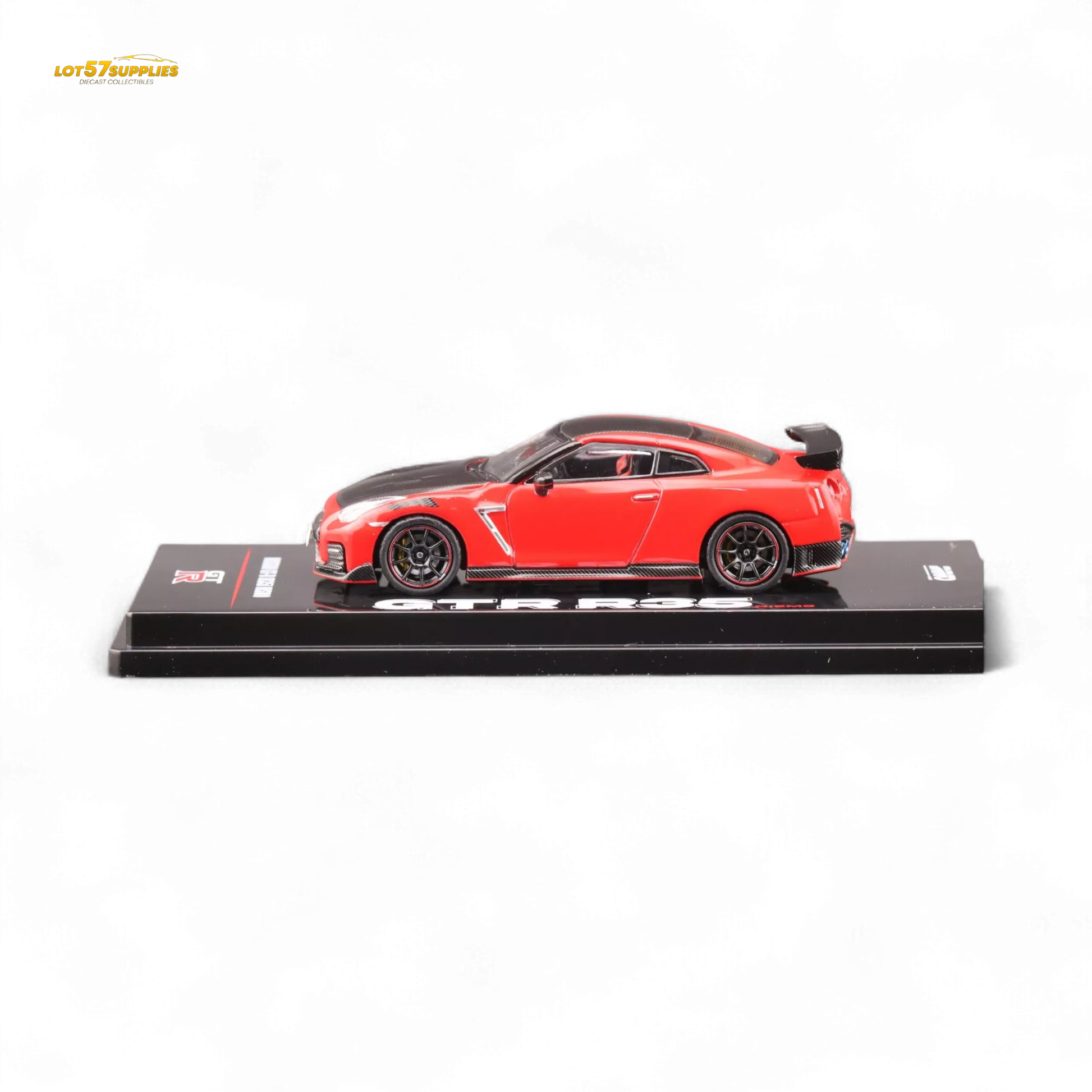 Red Inno64 Nissan GT-R R35 Nismo diecast model car, detailed miniature vehicle with distinctive Nissan design and Nismo branding.