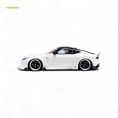 White Nissan 400Z diecast model car in 1:64 scale by Lot57Supplies Diecast Shop, detailed miniature vehicle with Nissan branding.