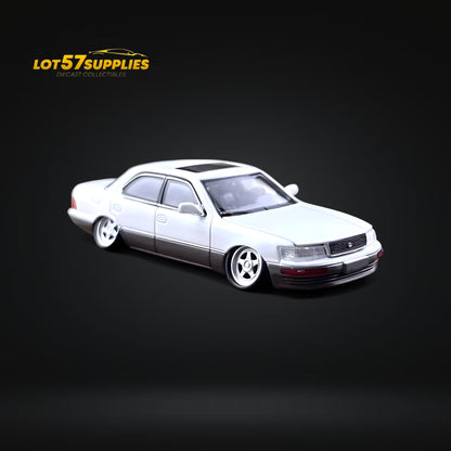 White and gray 1:64 scale Lexus LS400 diecast model with double stance, detailed features, from Lot57Supplies Diecast Shop.