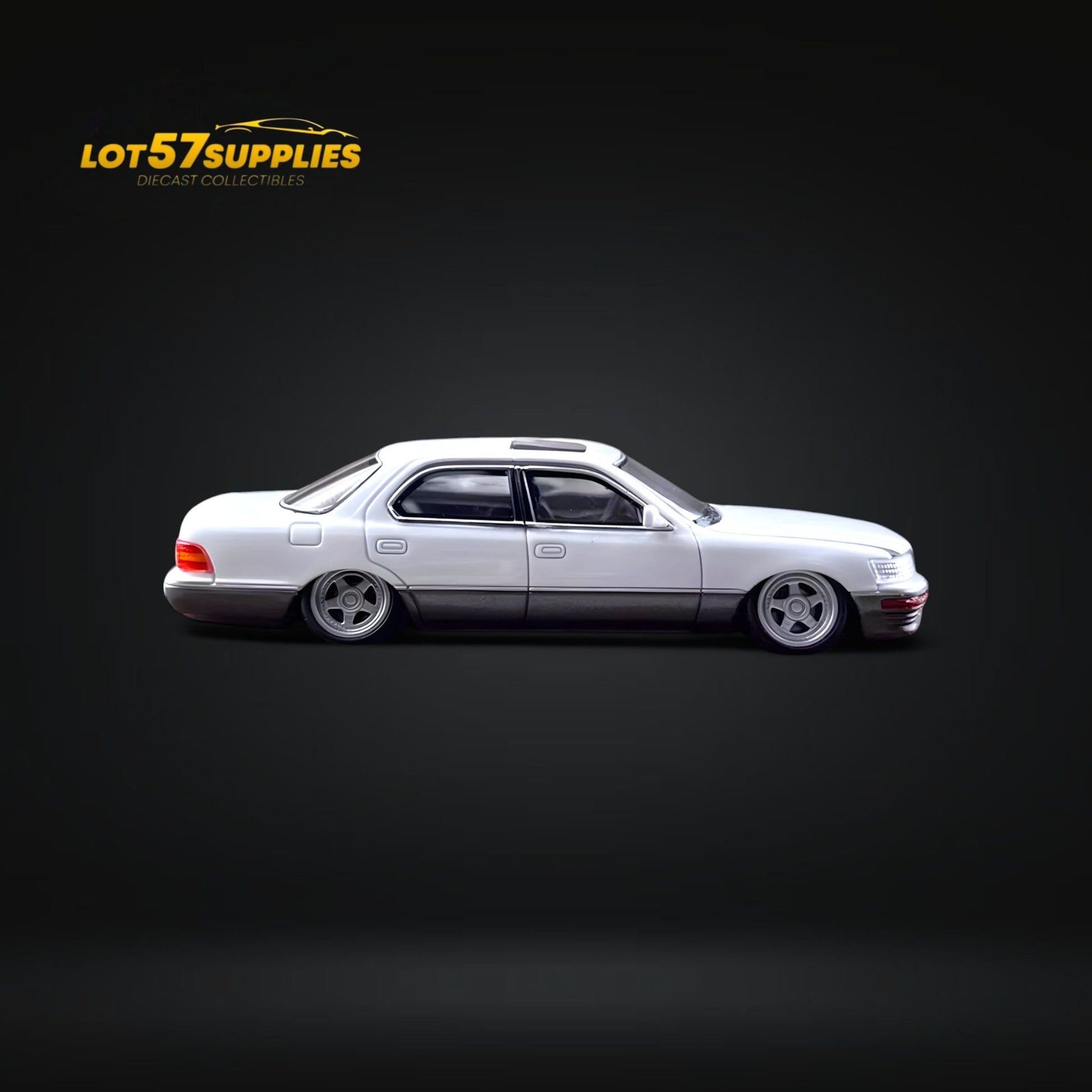White and gray Lotus 57 Lexus LS400 diecast model in 1:64 scale with a double stance, detailed and realistic.