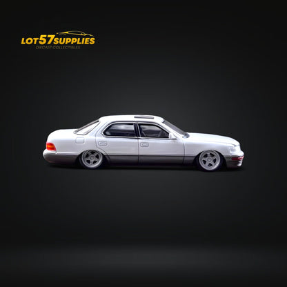 White and gray Lotus 57 Lexus LS400 diecast model in 1:64 scale with a double stance, detailed and realistic.
